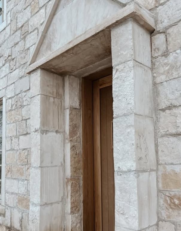 Carved limestone door surround
